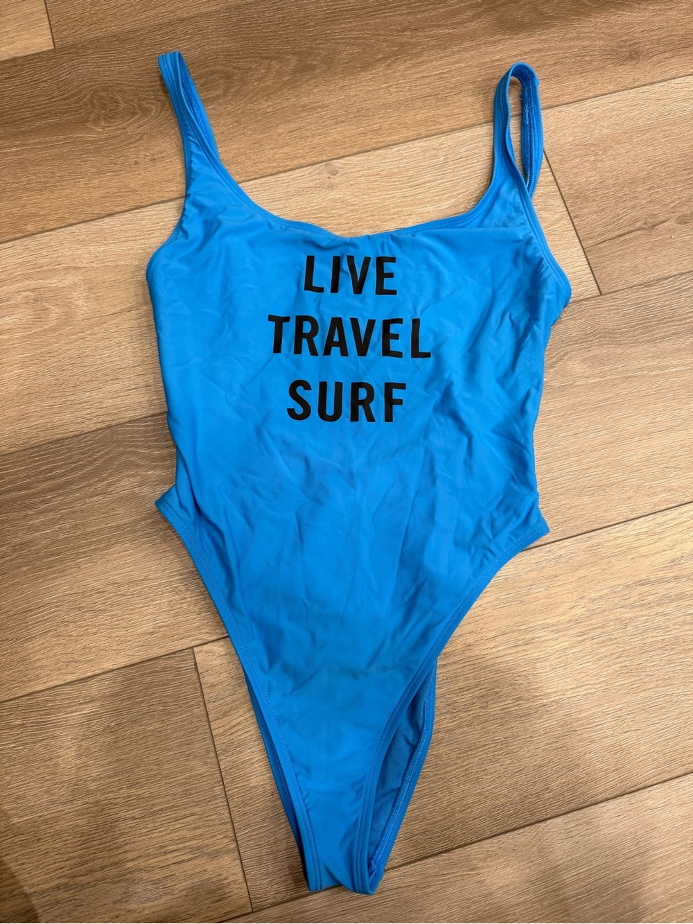 Blue One-Piece Swimsuit with "LIVE TRAVEL SURF" Print